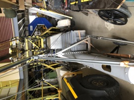 Float trailer loop and boom storage